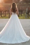A sense of elegance surrounds a woman wearing the A1252 by Allure, a stunning white dress.