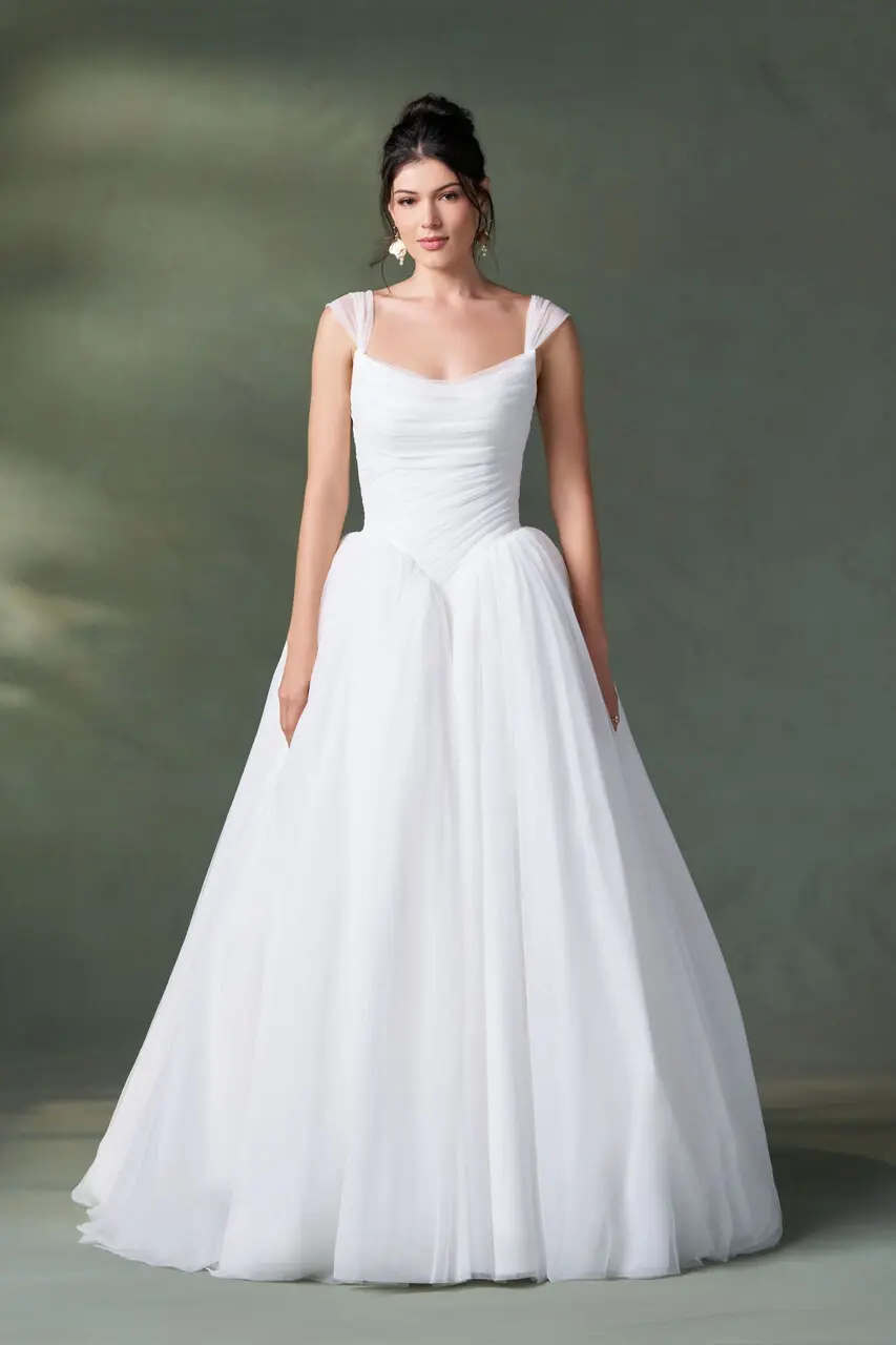 The A1500 by Allure is a white A-line wedding dress featuring a ruched bodice, sweetheart neckline, and tulle skirt. The A1500 by Allure is a white A-line wedding dress featuring a ruched bodice, sweetheart neckline, and tulle skirt.