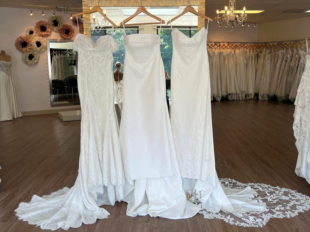 Three fitted wedding dresses in full lace, mikado, and crepe with lace at Flares Bridal