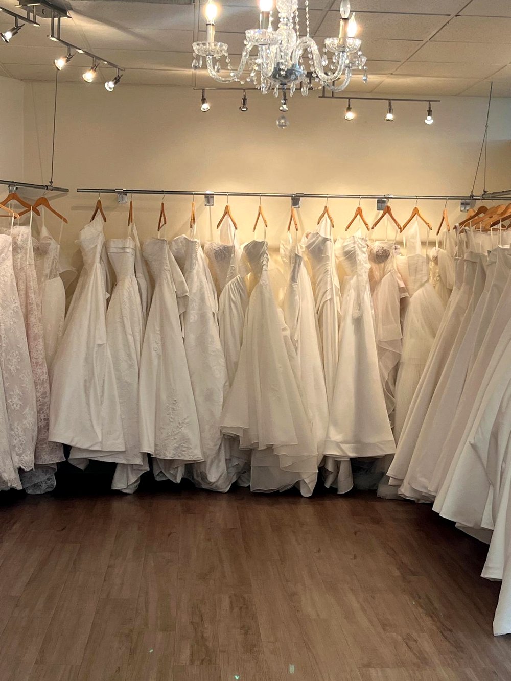 Wedding dress collection on the rail at Flares Bridal + Formal in Walnut Creek